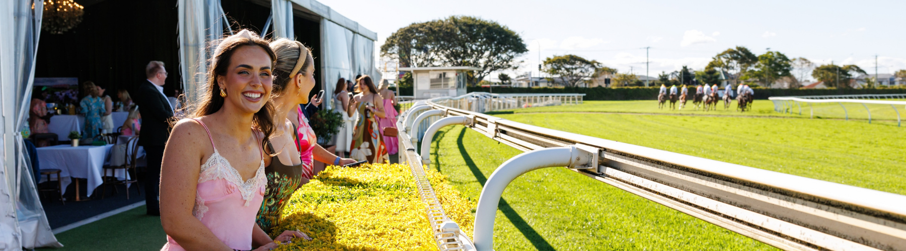 A woman watches the horse racing