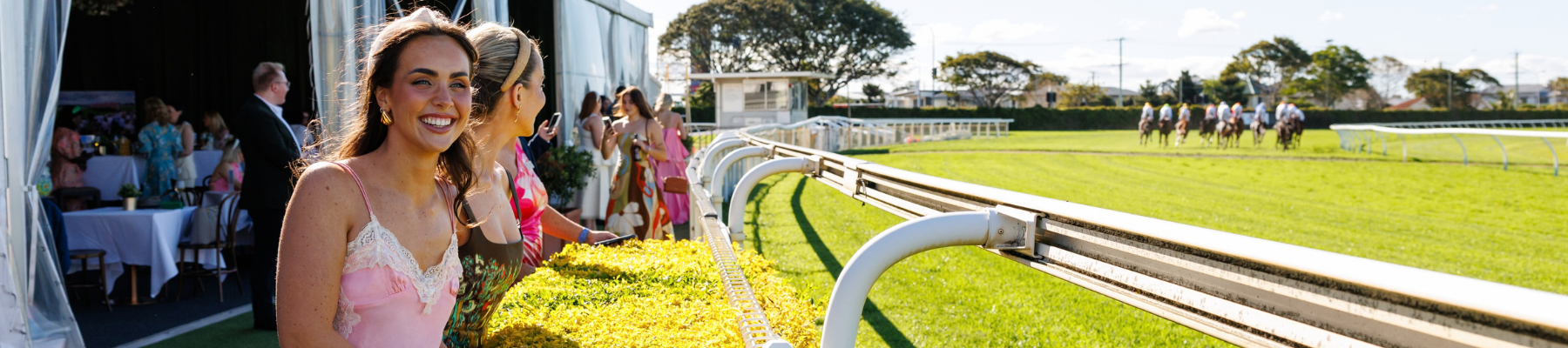 A woman watches the horse racing
